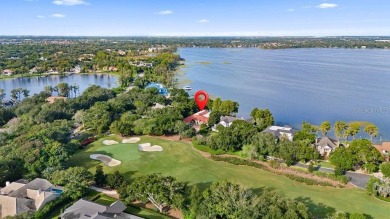 Tucked within the gates of Isleworth Golf Community and Country on Isleworth Golf and Country Club in Florida - for sale on GolfHomes.com, golf home, golf lot