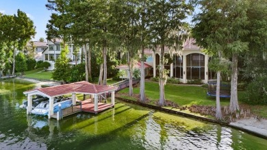 Tucked within the gates of Isleworth Golf Community and Country on Isleworth Golf and Country Club in Florida - for sale on GolfHomes.com, golf home, golf lot