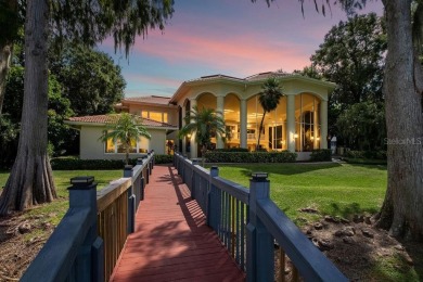 Tucked within the gates of Isleworth Golf Community and Country on Isleworth Golf and Country Club in Florida - for sale on GolfHomes.com, golf home, golf lot