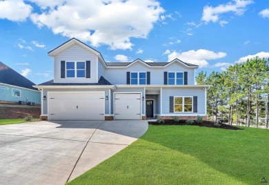 Nestled on the corner lot is an absolute gorgeous new on Canongate At Healy Point Country Club in Georgia - for sale on GolfHomes.com, golf home, golf lot