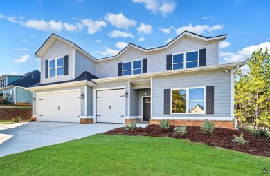 Nestled on the corner lot is an absolute gorgeous new on Canongate At Healy Point Country Club in Georgia - for sale on GolfHomes.com, golf home, golf lot