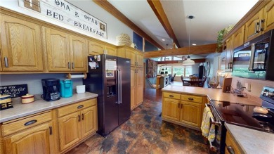 Nestled along the rolling greens of the golf course, this on Green Lea Golf Course in Minnesota - for sale on GolfHomes.com, golf home, golf lot