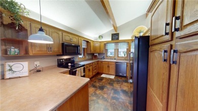 Nestled along the rolling greens of the golf course, this on Green Lea Golf Course in Minnesota - for sale on GolfHomes.com, golf home, golf lot
