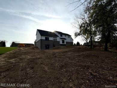 Final touches being completed now on this beautiful new on Prestwick Village Golf Club in Michigan - for sale on GolfHomes.com, golf home, golf lot