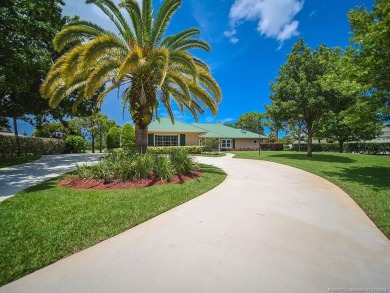 Nestled on a private acre w/majestic golf course views, this on Evergreen Club in Florida - for sale on GolfHomes.com, golf home, golf lot