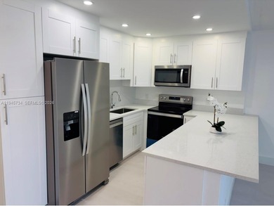 A must see!! Completely Remodeled, Modern and Full of Natural on Hillsboro Pines Golf in Florida - for sale on GolfHomes.com, golf home, golf lot