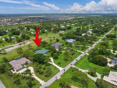 Nestled on a private acre w/majestic golf course views, this on Evergreen Club in Florida - for sale on GolfHomes.com, golf home, golf lot