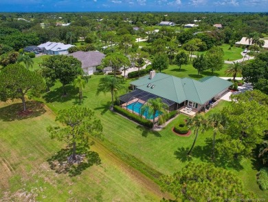 Nestled on a private acre w/majestic golf course views, this on Evergreen Club in Florida - for sale on GolfHomes.com, golf home, golf lot