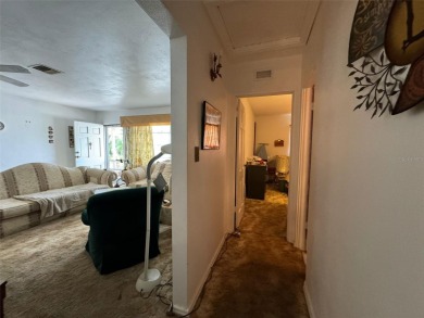 Investor Alert: 2 bedroom, 2 bathroom home featuring an open on Palm Aire Country Club of Sarasota in Florida - for sale on GolfHomes.com, golf home, golf lot