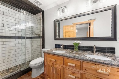 Custom-built timber cabin on over an acre with a 3-car garage on Terrace Lakes Golf Resort in Idaho - for sale on GolfHomes.com, golf home, golf lot