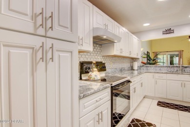 With a private, tranquil water and golf course view, this bright on Spruce Creek Golf Club in Florida - for sale on GolfHomes.com, golf home, golf lot