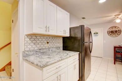 With a private, tranquil water and golf course view, this bright on Spruce Creek Golf Club in Florida - for sale on GolfHomes.com, golf home, golf lot