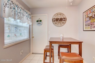 With a private, tranquil water and golf course view, this bright on Spruce Creek Golf Club in Florida - for sale on GolfHomes.com, golf home, golf lot