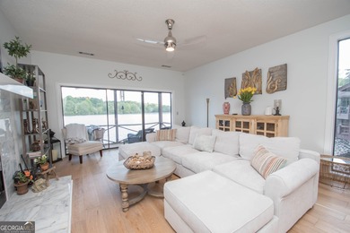 LAKEFRONT LIVING IN THE HEART OF PEACHTREE CITY!  Welcome to on Canongate At Flat Creek Club in Georgia - for sale on GolfHomes.com, golf home, golf lot