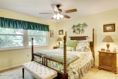 With a private, tranquil water and golf course view, this bright on Spruce Creek Golf Club in Florida - for sale on GolfHomes.com, golf home, golf lot
