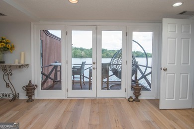 LAKEFRONT LIVING IN THE HEART OF PEACHTREE CITY!  Welcome to on Canongate At Flat Creek Club in Georgia - for sale on GolfHomes.com, golf home, golf lot