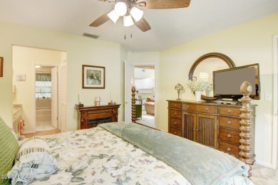 With a private, tranquil water and golf course view, this bright on Spruce Creek Golf Club in Florida - for sale on GolfHomes.com, golf home, golf lot