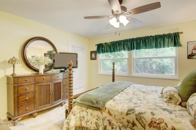 With a private, tranquil water and golf course view, this bright on Spruce Creek Golf Club in Florida - for sale on GolfHomes.com, golf home, golf lot