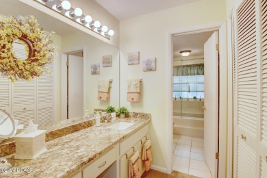 With a private, tranquil water and golf course view, this bright on Spruce Creek Golf Club in Florida - for sale on GolfHomes.com, golf home, golf lot