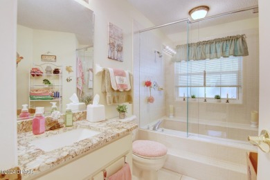 With a private, tranquil water and golf course view, this bright on Spruce Creek Golf Club in Florida - for sale on GolfHomes.com, golf home, golf lot