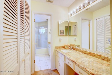 With a private, tranquil water and golf course view, this bright on Spruce Creek Golf Club in Florida - for sale on GolfHomes.com, golf home, golf lot