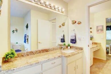 With a private, tranquil water and golf course view, this bright on Spruce Creek Golf Club in Florida - for sale on GolfHomes.com, golf home, golf lot