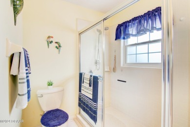 With a private, tranquil water and golf course view, this bright on Spruce Creek Golf Club in Florida - for sale on GolfHomes.com, golf home, golf lot