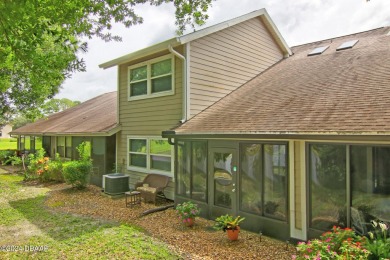 With a private, tranquil water and golf course view, this bright on Spruce Creek Golf Club in Florida - for sale on GolfHomes.com, golf home, golf lot