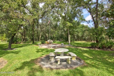 With a private, tranquil water and golf course view, this bright on Spruce Creek Golf Club in Florida - for sale on GolfHomes.com, golf home, golf lot