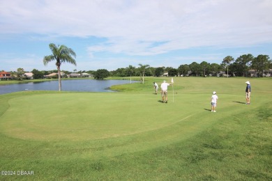 With a private, tranquil water and golf course view, this bright on Spruce Creek Golf Club in Florida - for sale on GolfHomes.com, golf home, golf lot