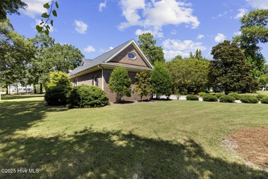 This beautiful brick home in River Landing seamlessly blends on River Landing Golf Course in North Carolina - for sale on GolfHomes.com, golf home, golf lot