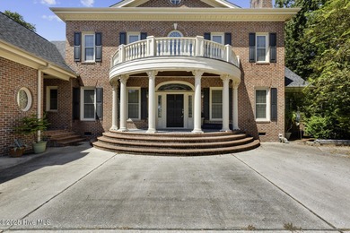 This beautiful brick home in River Landing seamlessly blends on River Landing Golf Course in North Carolina - for sale on GolfHomes.com, golf home, golf lot