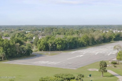 With a private, tranquil water and golf course view, this bright on Spruce Creek Golf Club in Florida - for sale on GolfHomes.com, golf home, golf lot