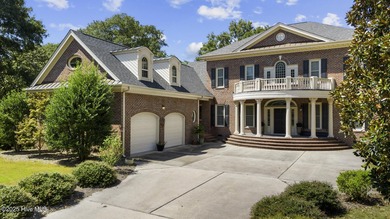 This beautiful brick home in River Landing seamlessly blends on River Landing Golf Course in North Carolina - for sale on GolfHomes.com, golf home, golf lot