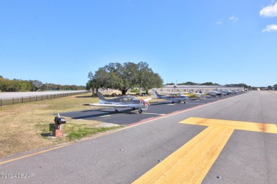 With a private, tranquil water and golf course view, this bright on Spruce Creek Golf Club in Florida - for sale on GolfHomes.com, golf home, golf lot