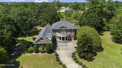 This beautiful brick home in River Landing seamlessly blends on River Landing Golf Course in North Carolina - for sale on GolfHomes.com, golf home, golf lot