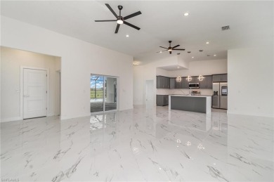Welcome to effortless luxury in the coveted Royal Palm Golf on Eagle Lakes Golf Club in Florida - for sale on GolfHomes.com, golf home, golf lot