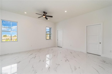 Welcome to effortless luxury in the coveted Royal Palm Golf on Eagle Lakes Golf Club in Florida - for sale on GolfHomes.com, golf home, golf lot