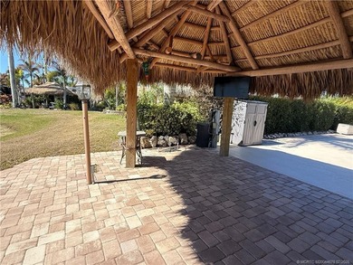 Nestled within an exclusive gated RV resort, this exceptional on St. Lucie Trail Golf Club in Florida - for sale on GolfHomes.com, golf home, golf lot
