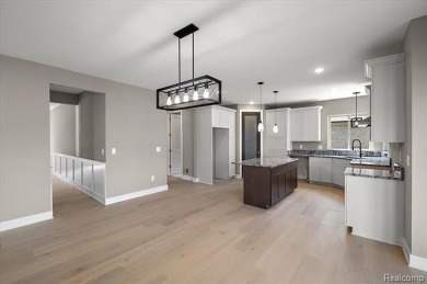 This turn-key, move-in ready home comes complete with sod and on Bello Woods Golf Club in Michigan - for sale on GolfHomes.com, golf home, golf lot
