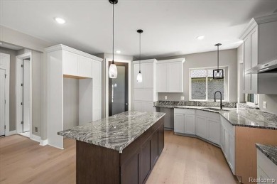 This turn-key, move-in ready home comes complete with sod and on Bello Woods Golf Club in Michigan - for sale on GolfHomes.com, golf home, golf lot