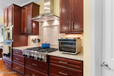 This exceptional residence, located within the esteemed Compass on Compass Pointe Golf Course in North Carolina - for sale on GolfHomes.com, golf home, golf lot