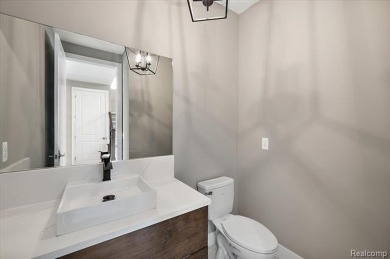 This turn-key, move-in ready home comes complete with sod and on Bello Woods Golf Club in Michigan - for sale on GolfHomes.com, golf home, golf lot
