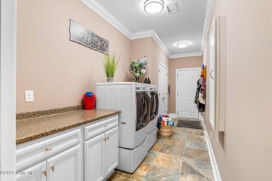 This exceptional residence, located within the esteemed Compass on Compass Pointe Golf Course in North Carolina - for sale on GolfHomes.com, golf home, golf lot