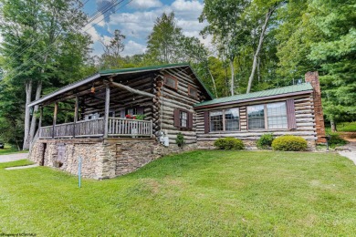 Welcome to *The Alpiner*, a delightful, historic LOG CABIN on Alpine Lake Resort in West Virginia - for sale on GolfHomes.com, golf home, golf lot