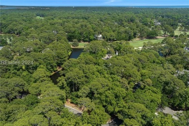 Nestled amidst stunning landscapes adorned with majestic trees on Long Cove Club in South Carolina - for sale on GolfHomes.com, golf home, golf lot