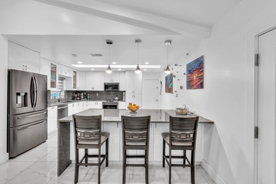 Beautifully renovated one story home featuring a modern open on Boca Greens Country Club in Florida - for sale on GolfHomes.com, golf home, golf lot