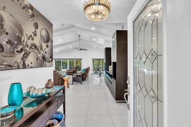 Beautifully renovated one story home featuring a modern open on Boca Greens Country Club in Florida - for sale on GolfHomes.com, golf home, golf lot