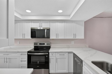 Discover carefree living in the vibrant 55+ community of Green on Tarpon Springs Golf Course in Florida - for sale on GolfHomes.com, golf home, golf lot