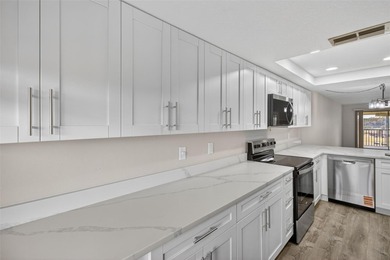 Discover carefree living in the vibrant 55+ community of Green on Tarpon Springs Golf Course in Florida - for sale on GolfHomes.com, golf home, golf lot